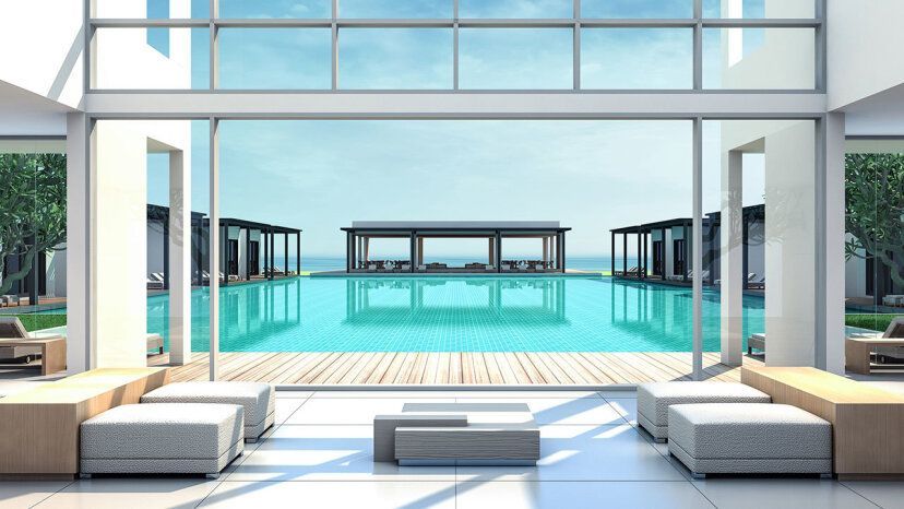 Moderner Blick auf einen Infinity-Pool im Paloma Finesse Side, eingerahmt von minimalistischer Architektur und eleganten Sonnenliegen-Pavillons mit Blick aufs Meer.